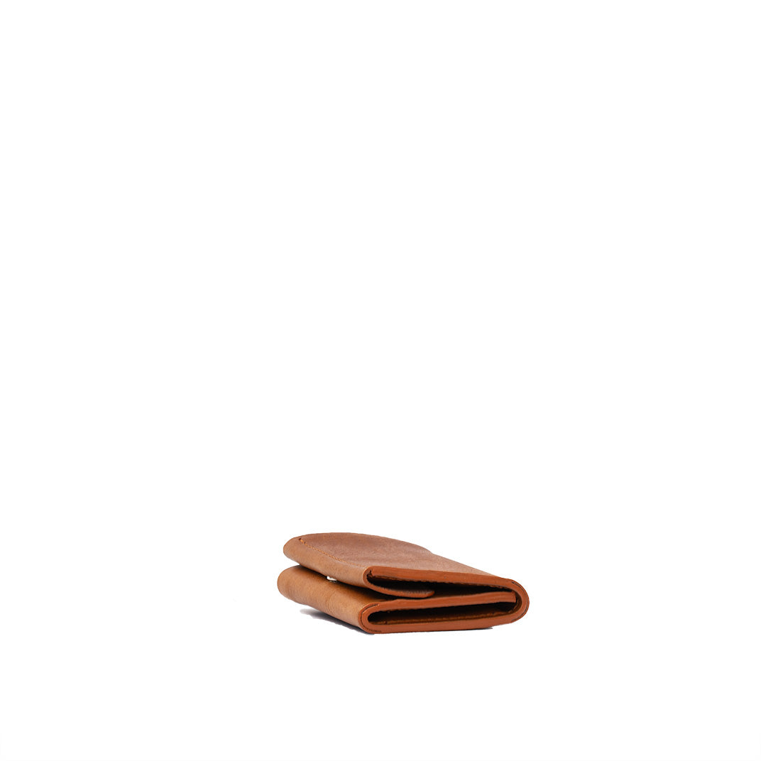 Tan color AirTag wallet trifold billfold illustrating its organized compartments and sleek finish