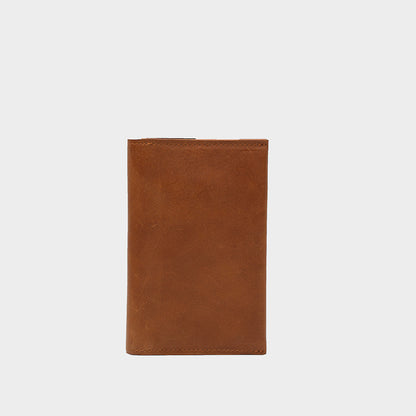 Folded tan Continental Wallet for AirTag showing the closed leather exterior